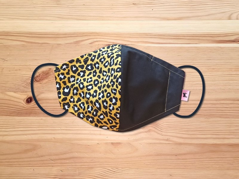 Leopard print cotton face masks with four breathable layers, available in different colors.
